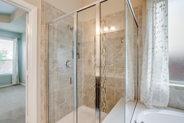 bathroom featuring separate shower and tub