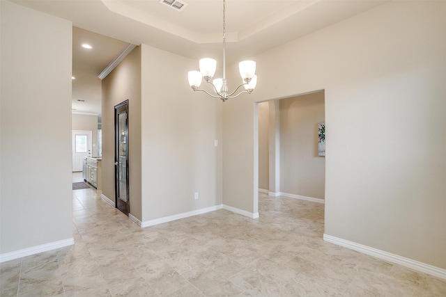 unfurnished room featuring an inviting chandelier and crown molding