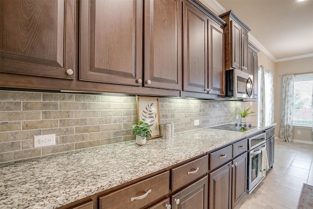 kitchen with appliances with stainless steel finishes, backsplash, ornamental molding, and light stone countertops