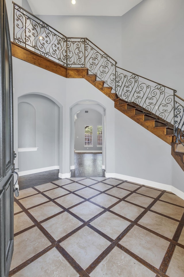 entrance foyer with a towering ceiling