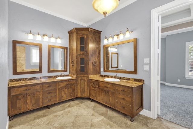 bathroom with vanity, ornamental molding, and tile patterned floors