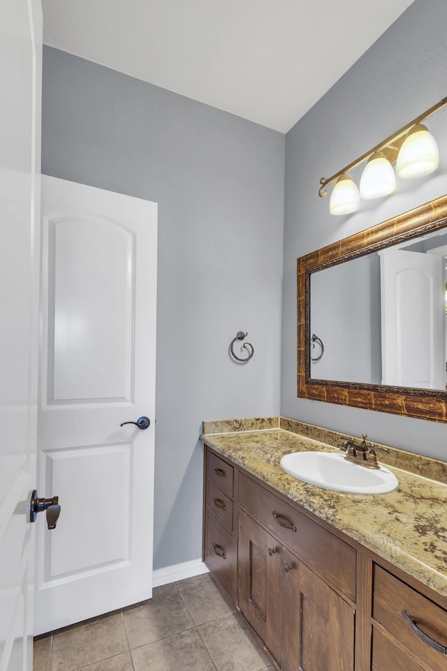 bathroom with tile patterned floors and vanity