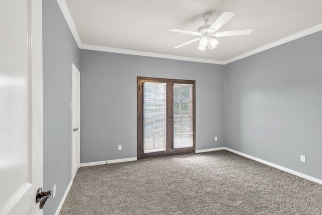 carpeted spare room featuring ceiling fan, french doors, and crown molding