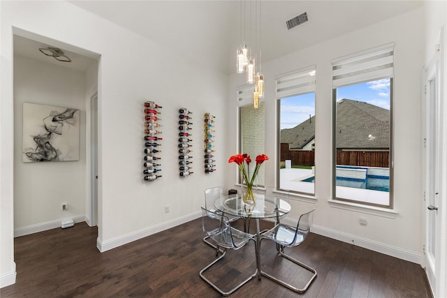 dining space featuring dark hardwood / wood-style flooring