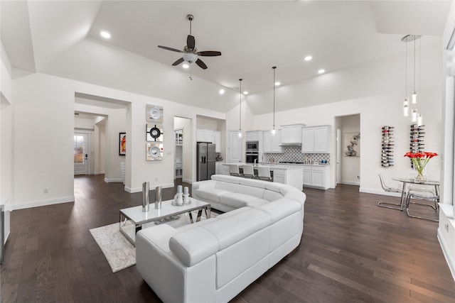 living room with ceiling fan, baseboards, dark wood finished floors, and recessed lighting