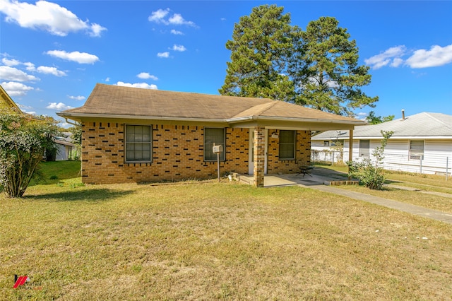 ranch-style home featuring a patio area and a front lawn