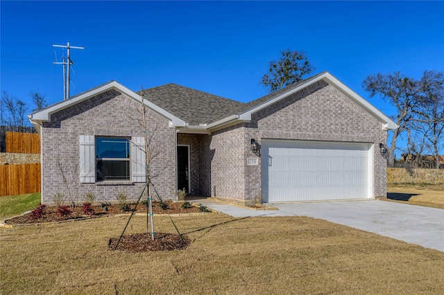 ranch-style house featuring a garage and a front yard