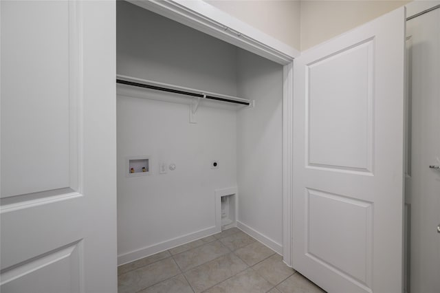 clothes washing area with gas dryer hookup, hookup for an electric dryer, hookup for a washing machine, and light tile patterned floors