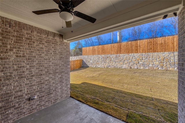 view of patio / terrace featuring ceiling fan