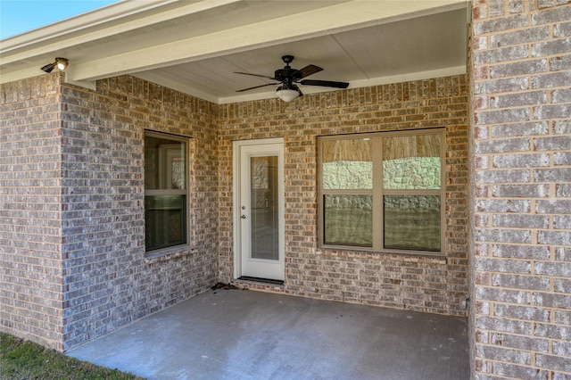 doorway to property featuring ceiling fan and a patio