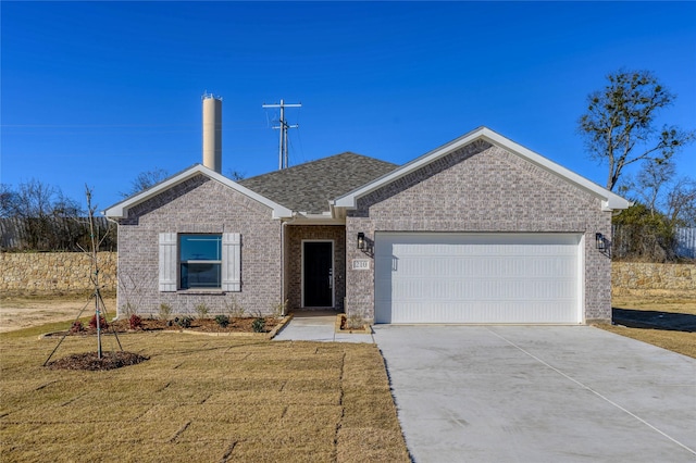 single story home with a garage and a front lawn