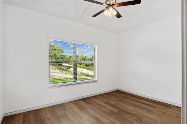 spare room with ceiling fan and hardwood / wood-style flooring