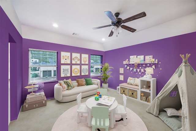 interior space featuring lofted ceiling, carpet flooring, and ceiling fan