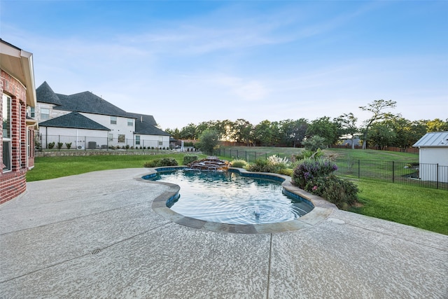 view of pool featuring a patio and a lawn