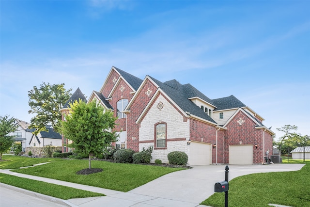 view of front of house with a front lawn and a garage