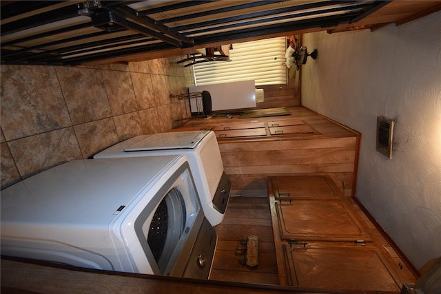 clothes washing area with washer and clothes dryer