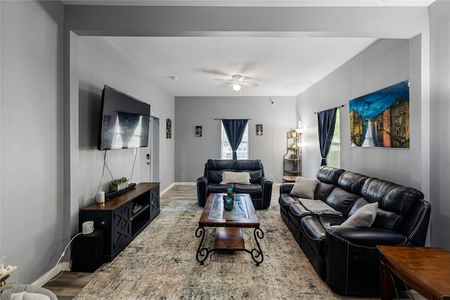 living room with hardwood / wood-style flooring and ceiling fan