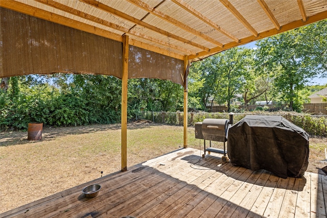 wooden terrace featuring a grill