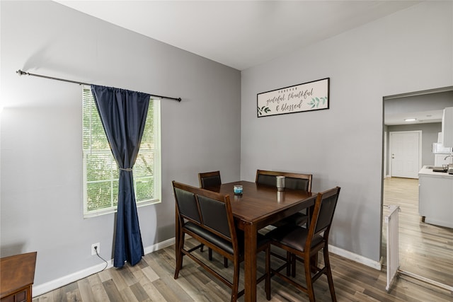 dining area with hardwood / wood-style flooring