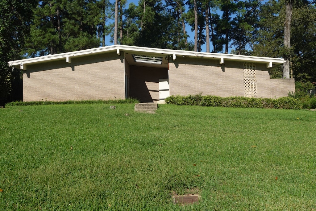 exterior space with a lawn