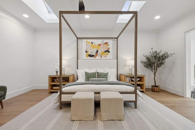 bedroom featuring crown molding and hardwood / wood-style floors