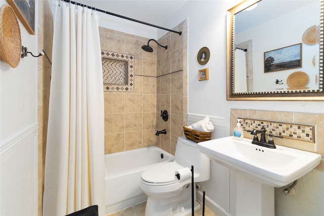 bathroom with shower / tub combo with curtain, tasteful backsplash, and toilet