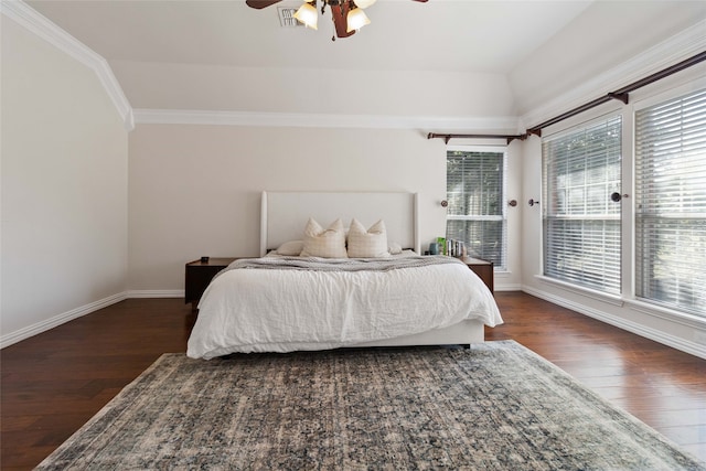 bedroom with ceiling fan, ornamental molding, and dark hardwood / wood-style flooring