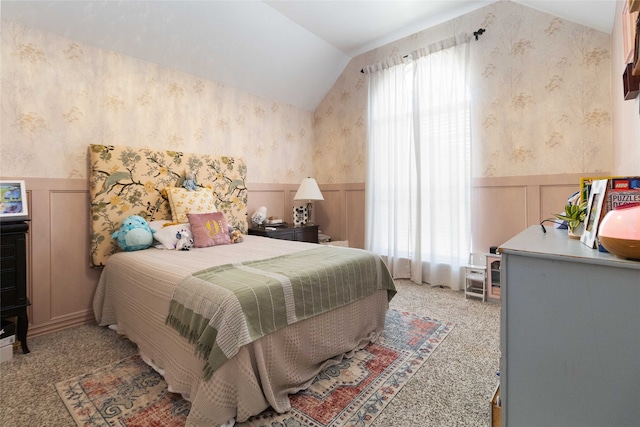 bedroom featuring vaulted ceiling and carpet