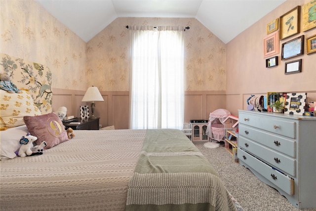 carpeted bedroom with lofted ceiling