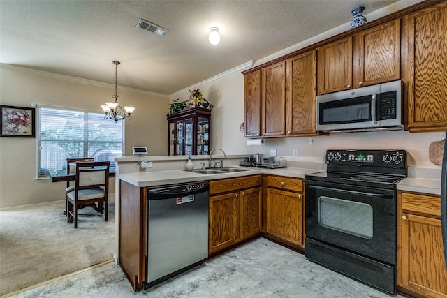 kitchen with sink, kitchen peninsula, a chandelier, stainless steel appliances, and light colored carpet