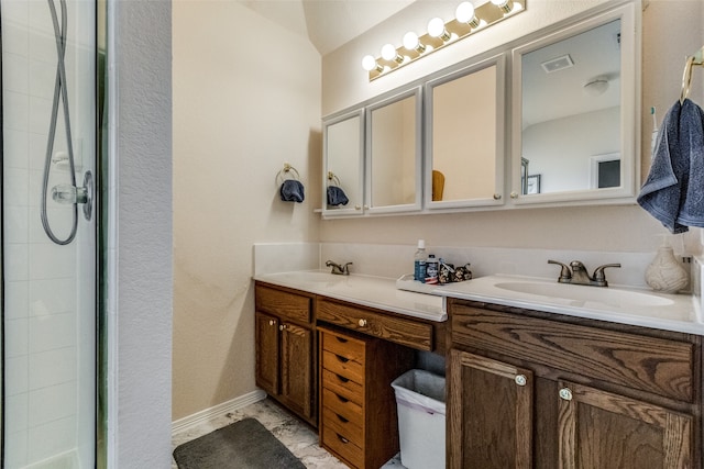 bathroom with vanity and an enclosed shower