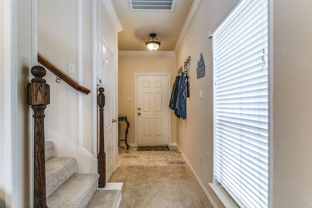 interior space featuring light colored carpet, crown molding, and plenty of natural light