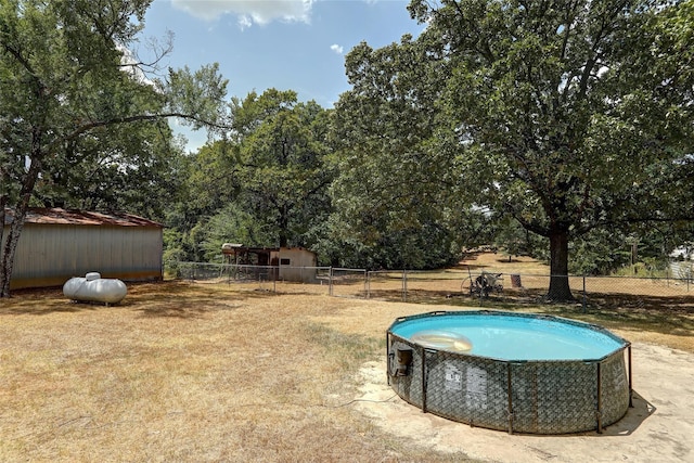 exterior space with a fenced in pool