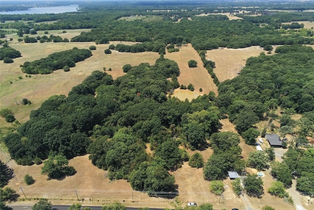 birds eye view of property featuring a water view and a rural view