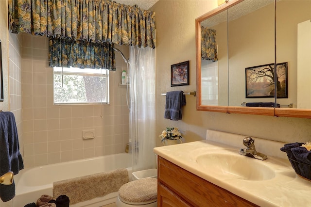 full bathroom with vanity, shower / bath combo with shower curtain, and toilet