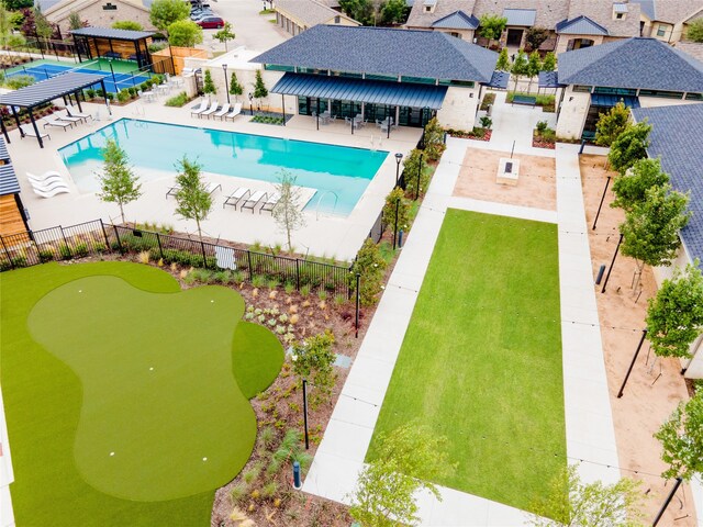 view of swimming pool featuring a patio area