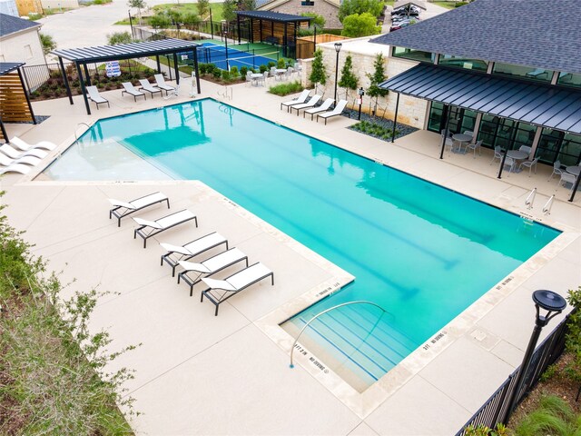 view of swimming pool with a patio