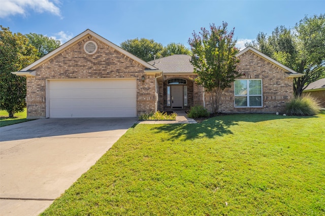 ranch-style home featuring a garage and a front lawn