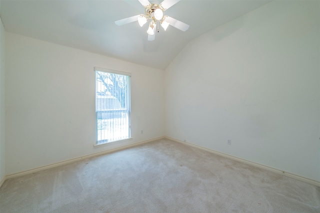 unfurnished room featuring ceiling fan, lofted ceiling, and light carpet