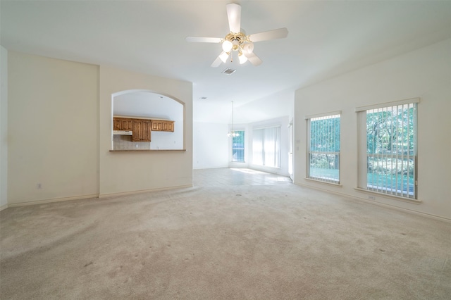 unfurnished living room featuring ceiling fan and light colored carpet