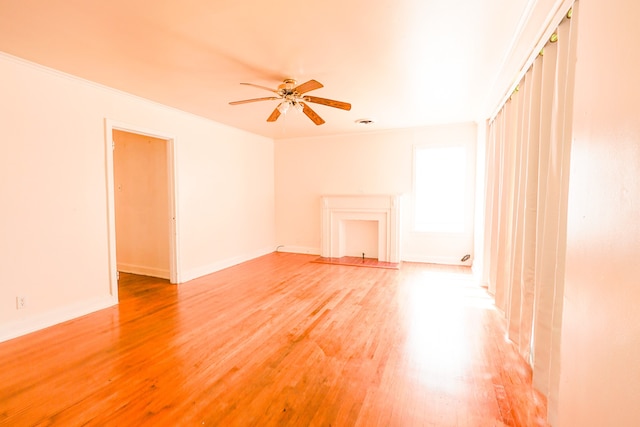 unfurnished room with ornamental molding, ceiling fan, and hardwood / wood-style floors