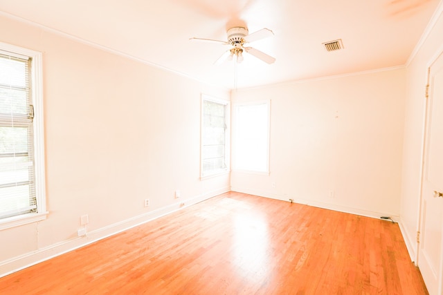 unfurnished room with light hardwood / wood-style flooring, ceiling fan, and crown molding