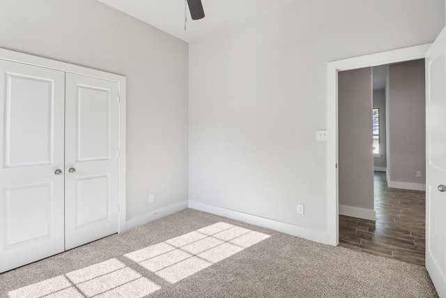 unfurnished bedroom with light hardwood / wood-style floors, ceiling fan, and a closet