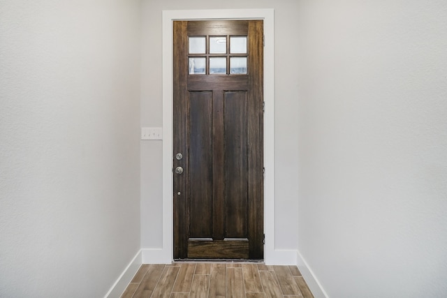 doorway with light wood-type flooring