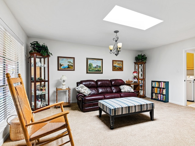 carpeted living room featuring an inviting chandelier, a skylight, and a healthy amount of sunlight