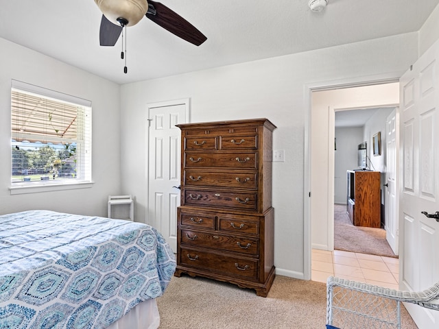 bedroom with light carpet and ceiling fan