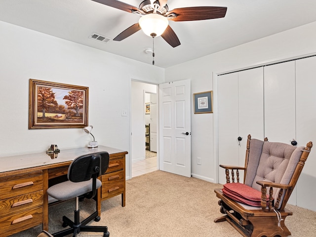 office with ceiling fan and light colored carpet