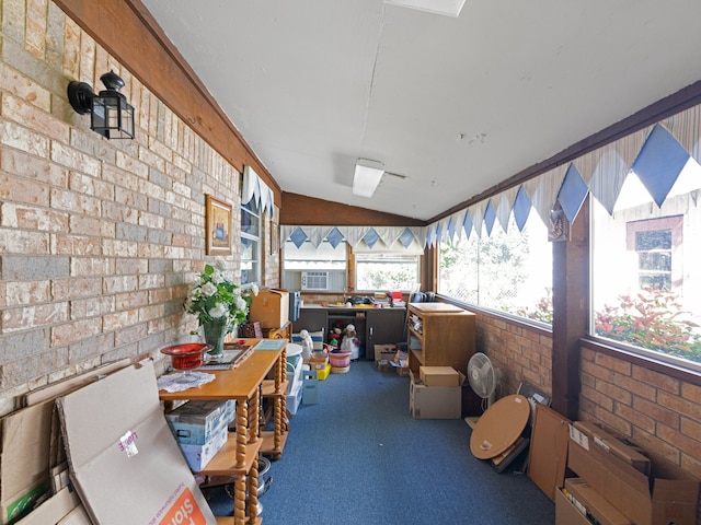 sunroom featuring vaulted ceiling