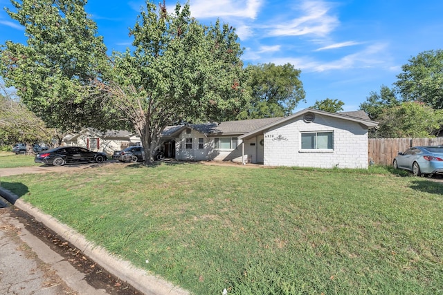 single story home featuring a front yard