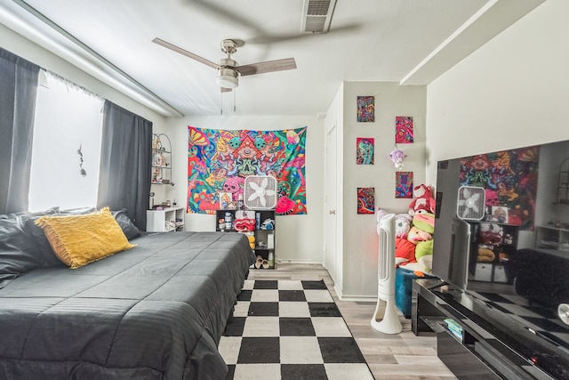 bedroom featuring ceiling fan and hardwood / wood-style flooring